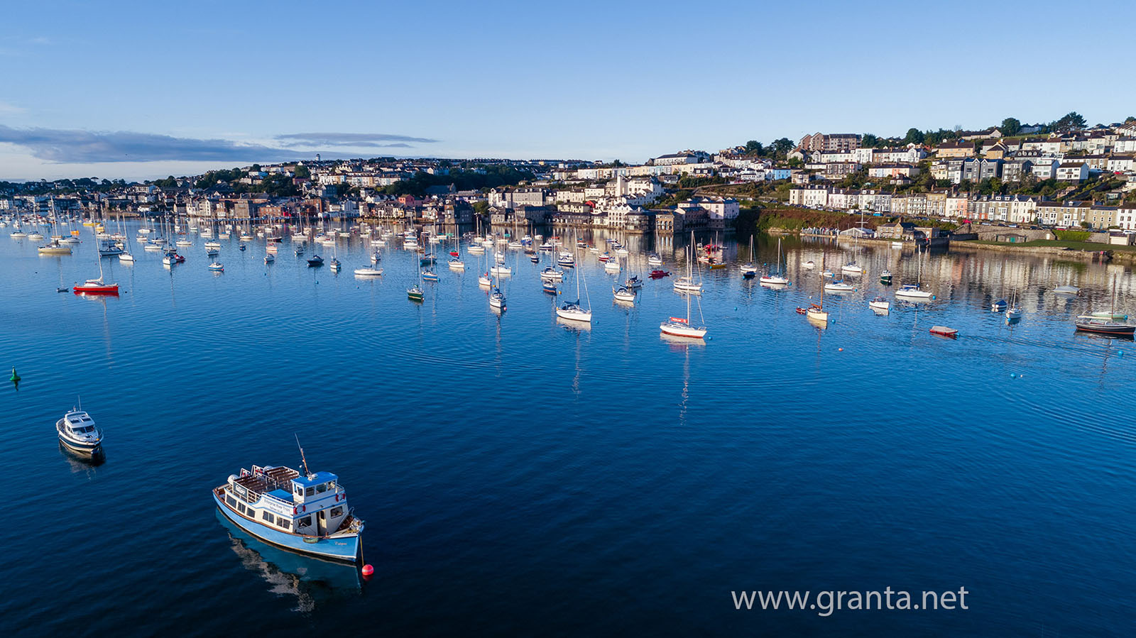 Boats moored up in Falmouth harbour at dawn, summer 2018
